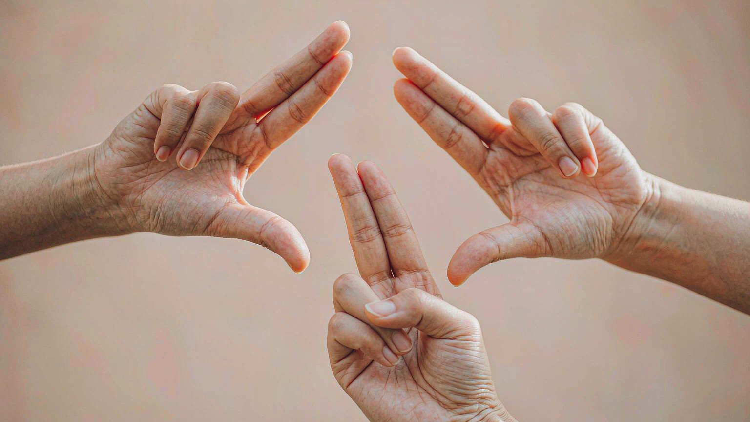 Three hands demonstrating Chinese number gestures: the two-finger sign for two, the thumb-and-little-finger sign for six, and the thumb-and-index L shape for eight